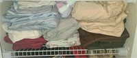 Estate shelf of towels, sheets, ect