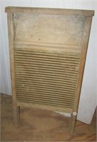Vintage wood washboard. Measures 24" tall.