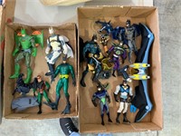 two boxes of batman figurines