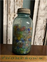 Large blue jar of marbles