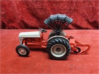 Ertl Tractor toy w/plow & canopy.