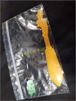 yellow plastic Mr. Peanut knife, 1950s