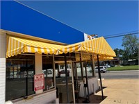 Awnings around building buyer must remove