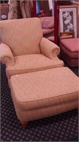 Chair with rolled arms, upholstered in