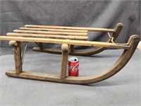 Vintage European wooden sled.  27" length.  Metal