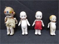 Group of 4 tiny dolls