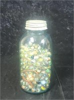 Half gallon blue ball jar full of marbles