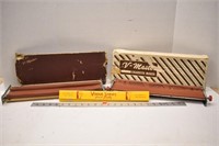 Two vintage V-Master cigarette rollers with some