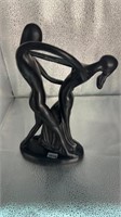 Two abstract dancing statues