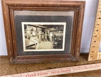 Framed old photo of tire shop