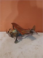 Metal airplane music box, 5 in by 11 in