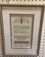 Framed cross stitch with different styles of