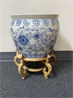 Large blue and white porcelain planter on wooden