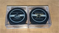 2 Dallas Stars Official NHL Hockey Pucks in Case