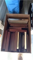 Box of empty picture frames and photo albums