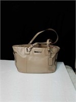 Beautiful tan colored leather coach purse just in