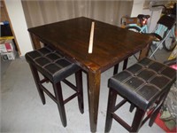 Pub Height Dining Table & 4pc Saddle Stool Set