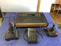 Vintage Atari game console and controllers.