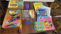 Crafting scissors, crayons, color books, “Family