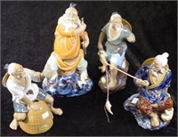 Four Chinese ceramic fisherman figurines