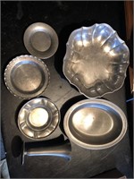 Group of pewter bowl, plates, bread dish, vase