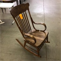 VINTAGE ROCKING CHAIR - CARVED BACK AND WOOD ARMS