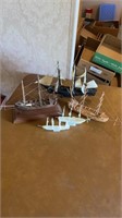 5 wooden and plastic ships.