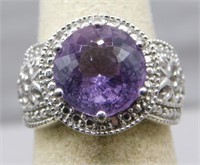 Sterling Silver ring with purple stone, size 6.