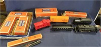 Assortment of Lionel Train Cars and Lionel Boxes