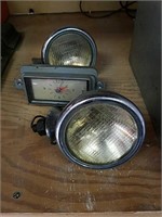 Pair of lights and a vintage clock model of car