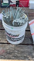 Bucket of large screws only.