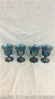 Four carnival glass goblets