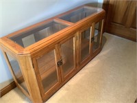 Sofa table with glass shelves and doors