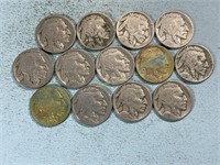 Thirteen worn date Buffalo nickels