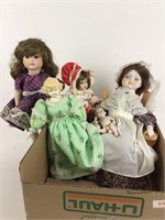 Box lot of porcelain dolls.