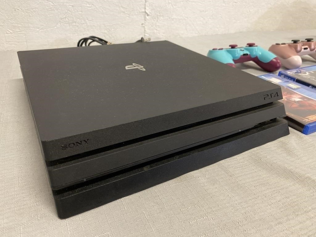 PlayStation 4, 2 Controllers, & 3 Games