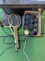 Vintage rackets and lots of tennis balls