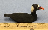 2 1/2" carved ivory Surf seater bird, with fine sc