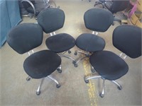 Four Rolling Swivel Chairs with Black Seat Covers