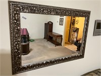 Large ornate silver framed mirror