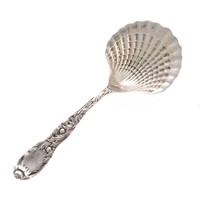 Sterling silver serving spoon with shell bowl