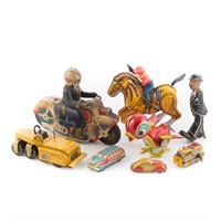 Eight lithographed tin toys