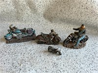 4 motorcycle statuettes.