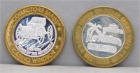 (2) CASINO TOKENS WITH SILVER CENTERS.