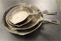 (4) CAST IRON SKILLETS (DIFFERENT SIZES)
