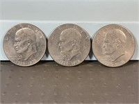 Three 1976D Ike dollars