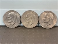 Three 1974D Ike dollars