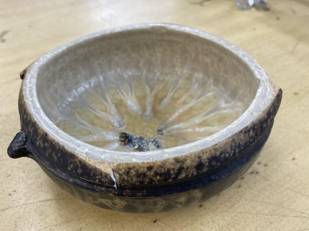 Pottery bowl marked Aasin- has a chip in it