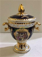 Beautiful mantle urn depicting Victorian era