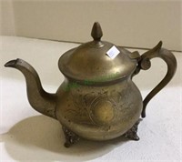 Brass teapot with engraving on footed base